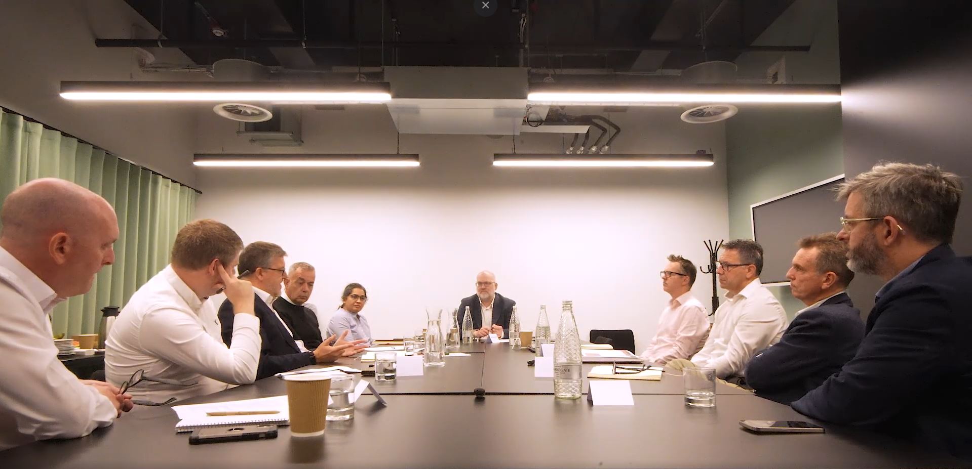 Industry professionals seated around a roundtable discussion