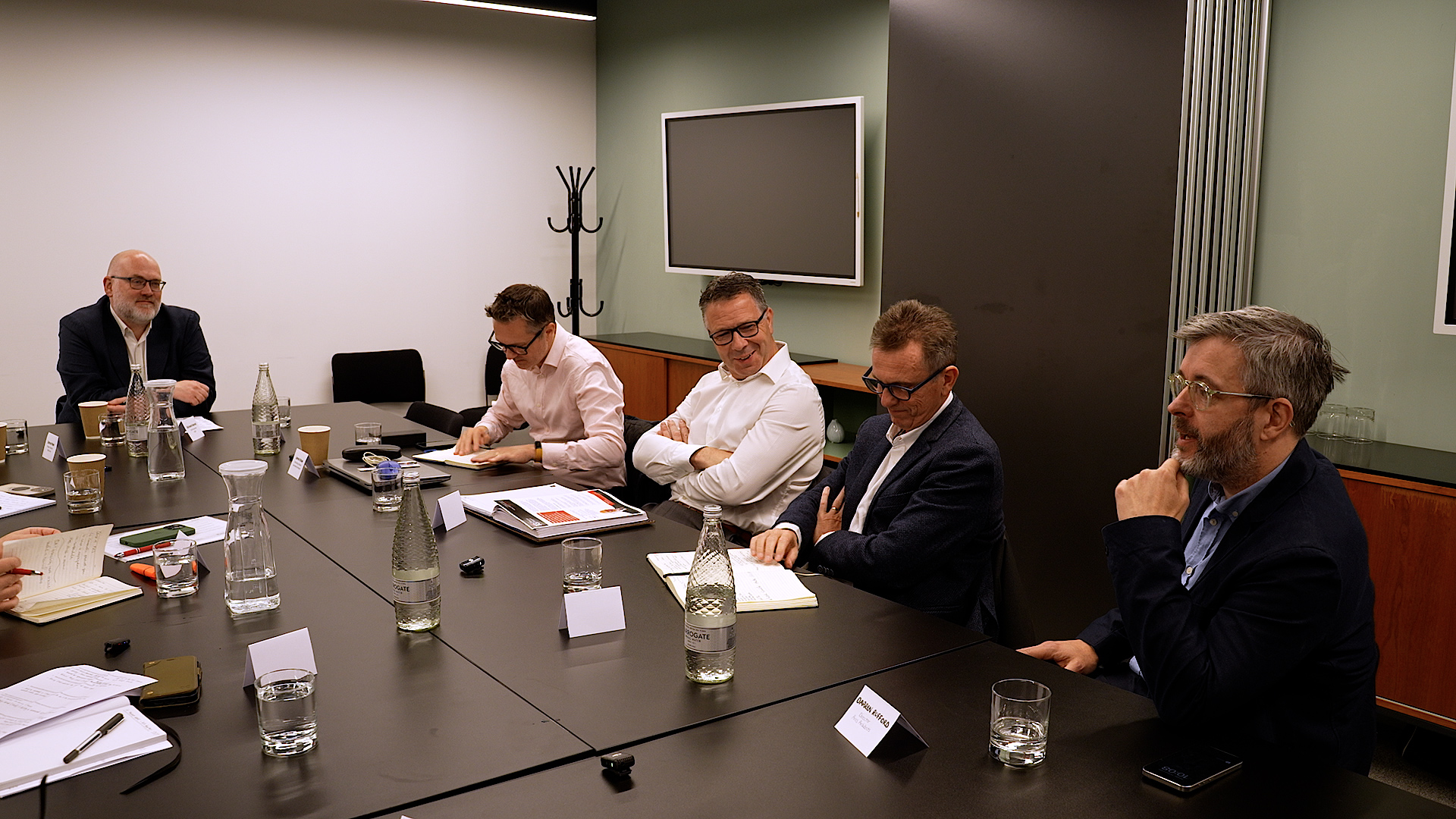 Industry experts in discussion around the roundtable table