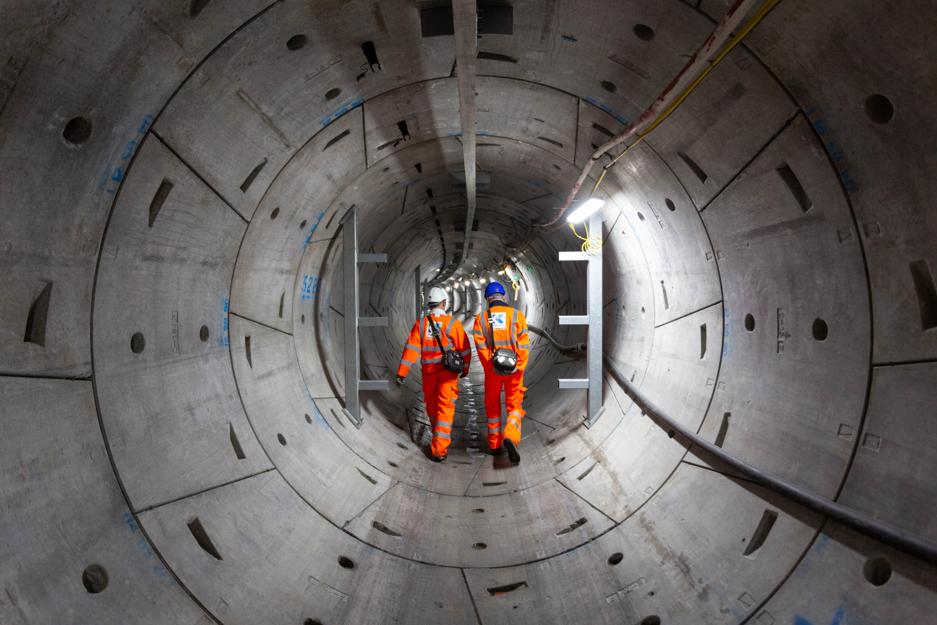 Kilnbridge engineers walking inside a large-diameter tunnel