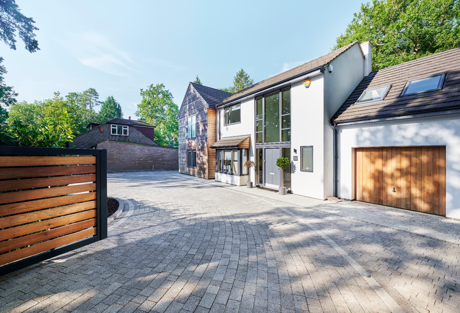 Lugano Graphite Grey driveway with Misty Grey border and Drivestyle kerb