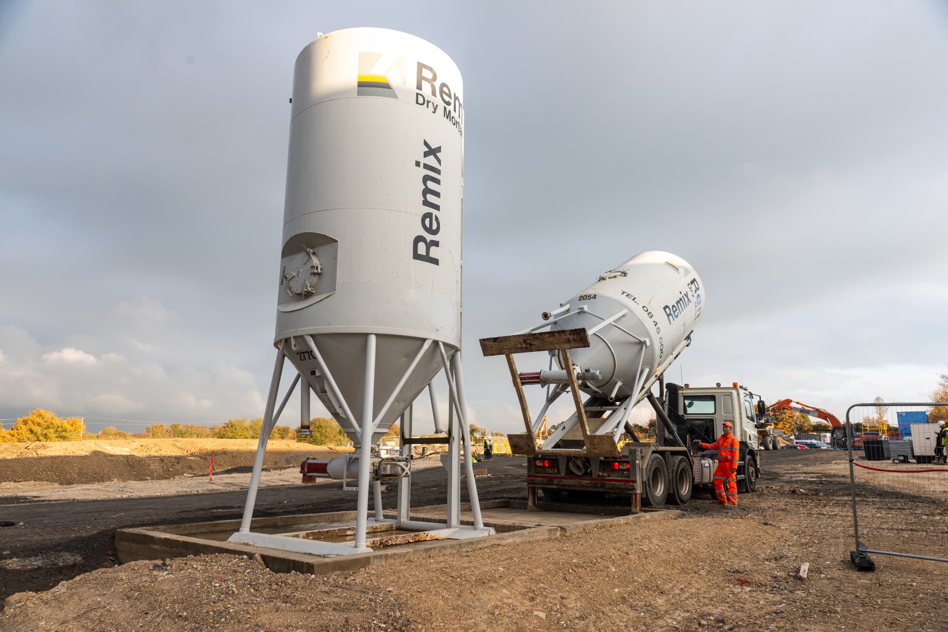 Remix Dry Mortar silo and delivery tanker on a housebuilding site