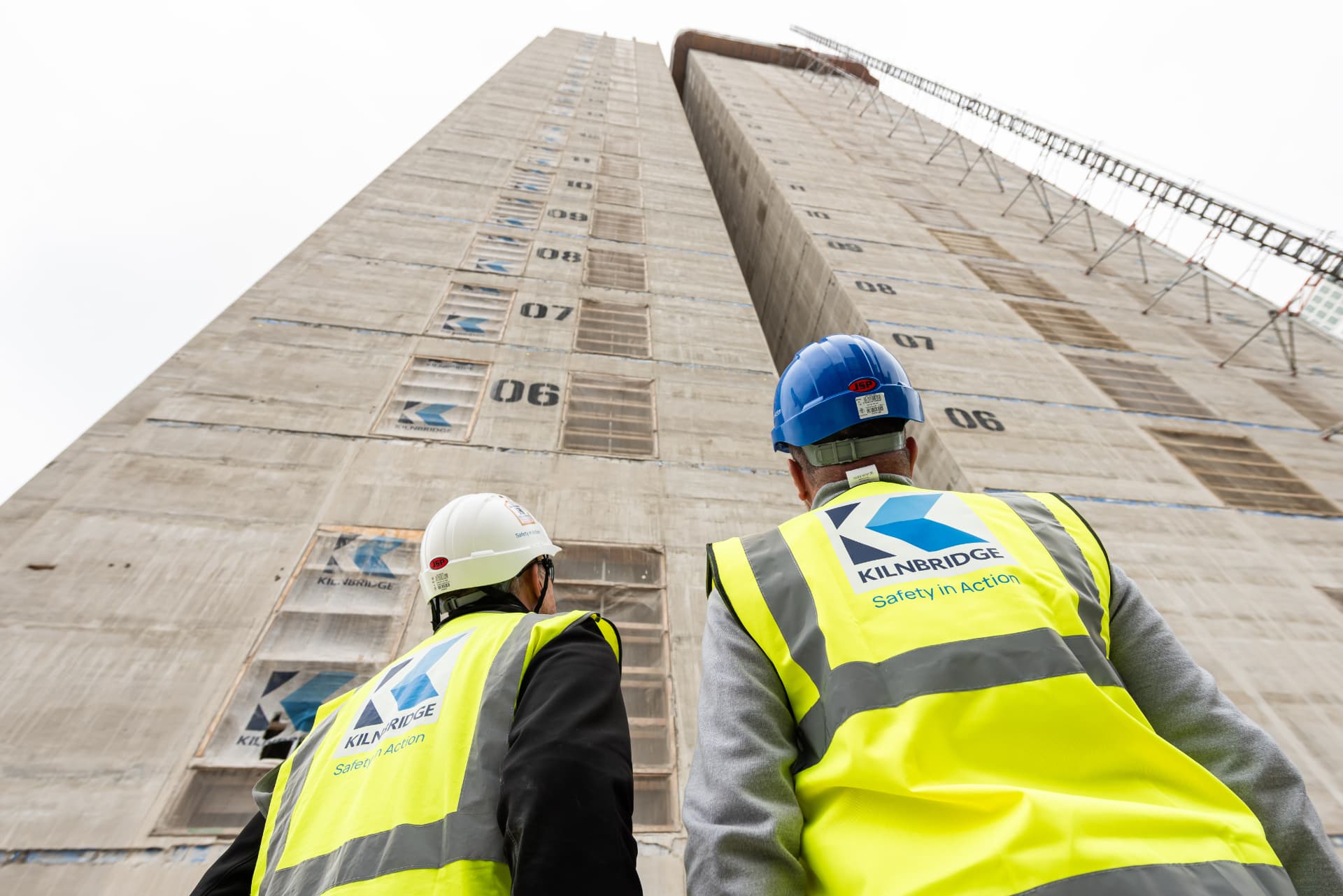 Kilnbridge team reviewing a high-rise concrete frame on site